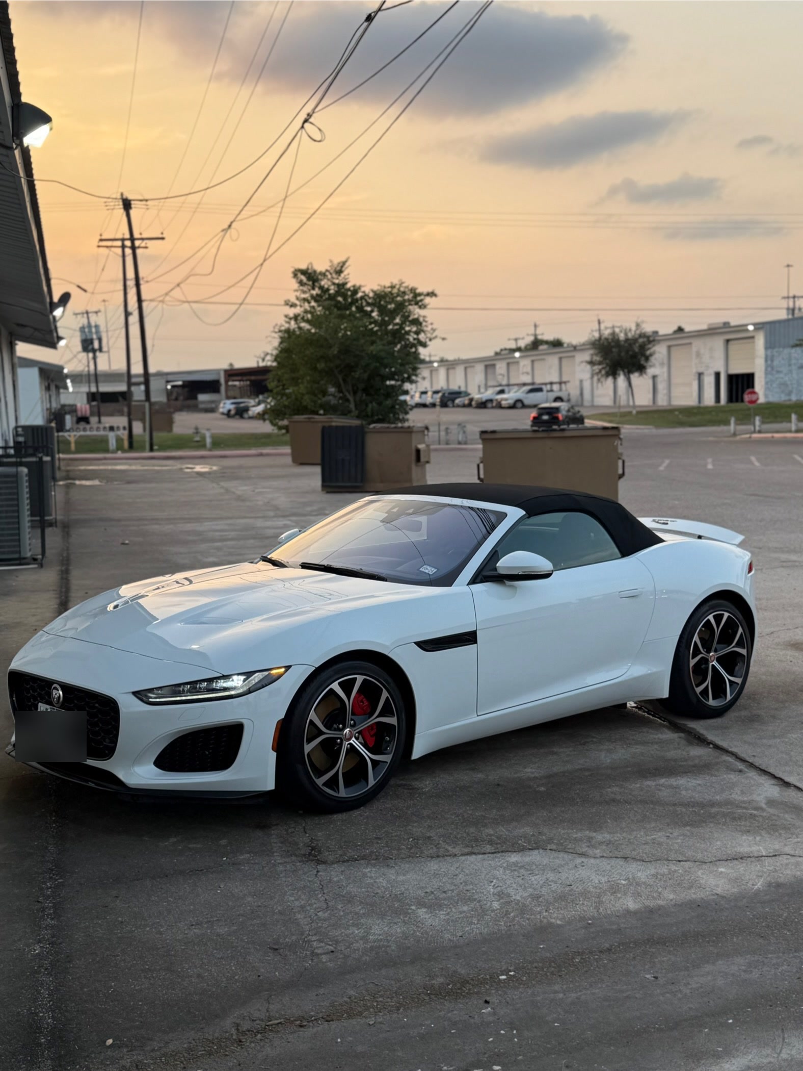 White Jaguar F-Type with a glossy ceramic-coated finish reflecting the sunset, detailed by I Auto Detailing in McAllen, TX