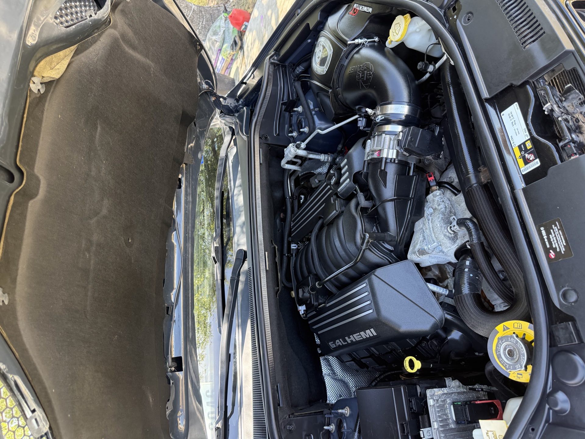 Cleaned and dressed engine bay handled on site during a mobile visit by I Auto Detailing in McAllen, TX