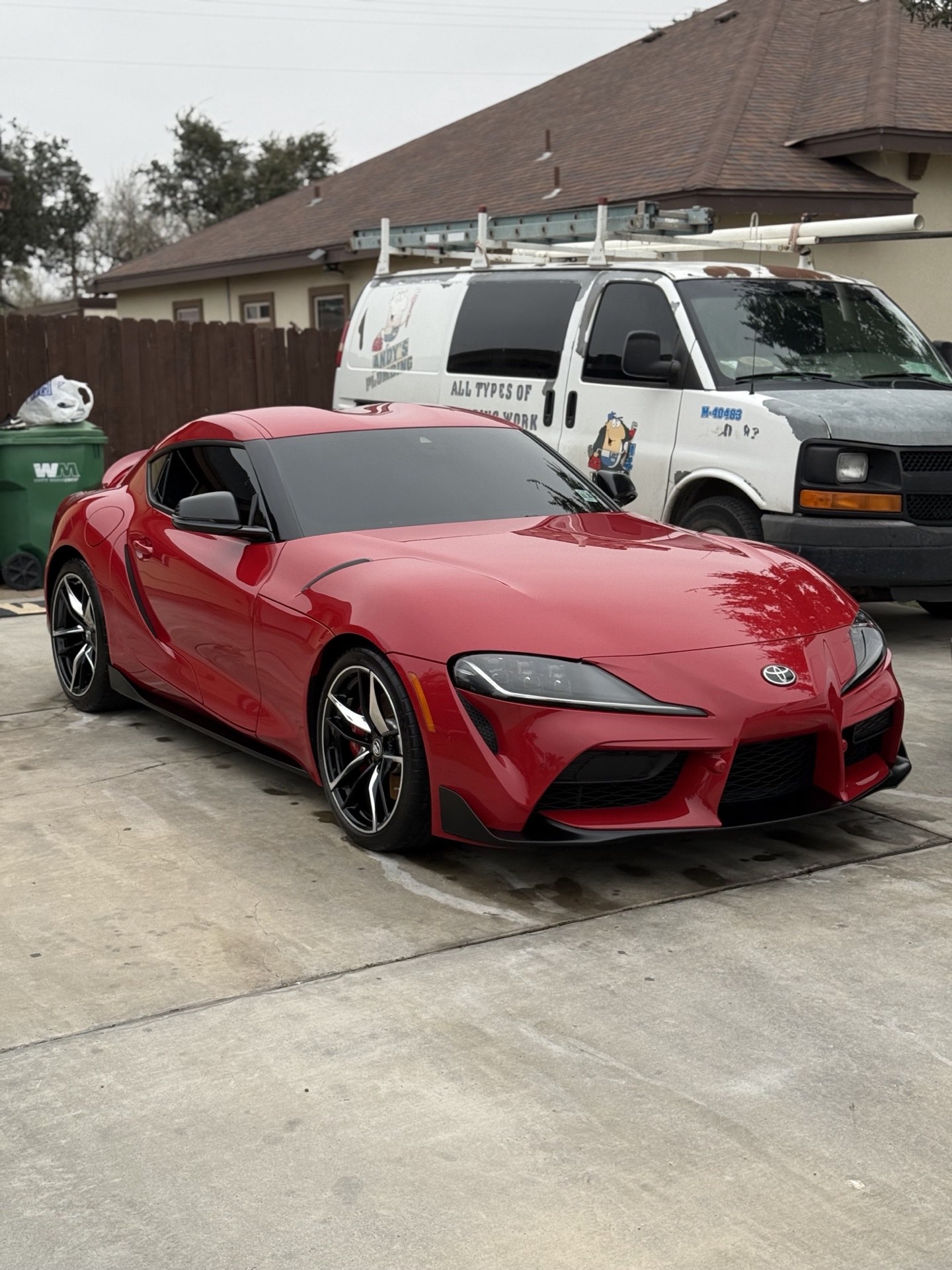 Glossy red Toyota GR Supra showing a deep, mirror-clear reflection after paint correction by I Auto Detailing in McAllen, TX