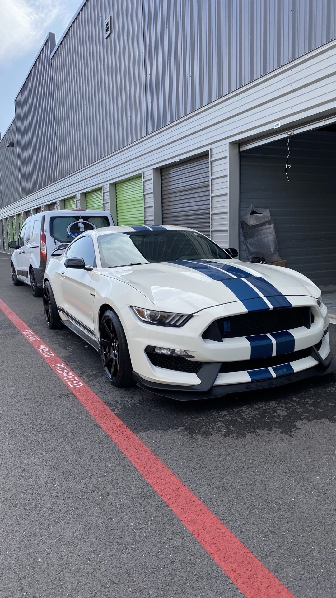 White Shelby GT350 with blue racing stripes and a deep, corrected, ceramic-ready finish by I Auto Detailing in McAllen, TX